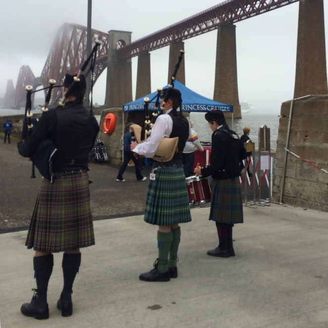 A lovely welcome: pipes, drum, and kilted Scotsmen.